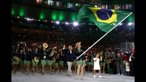 Pentathlete Yane Marques leads Brazil's athletes into the Maracana Stadium.
