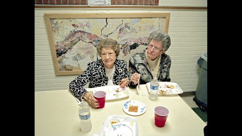 Two sisters eat as they attend a Sacred Harp gathering in Ephesus, Georgia.