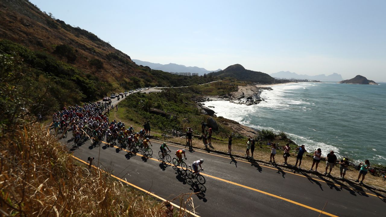The peleton passes through Grumari during the men's road race in cycling. The race began at Fort Copacabana.