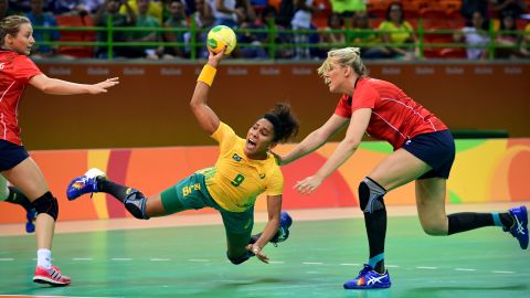 Brazil's Ana Paula Belo, center, shoots during the women's preliminaries Group A handball match against Norway.