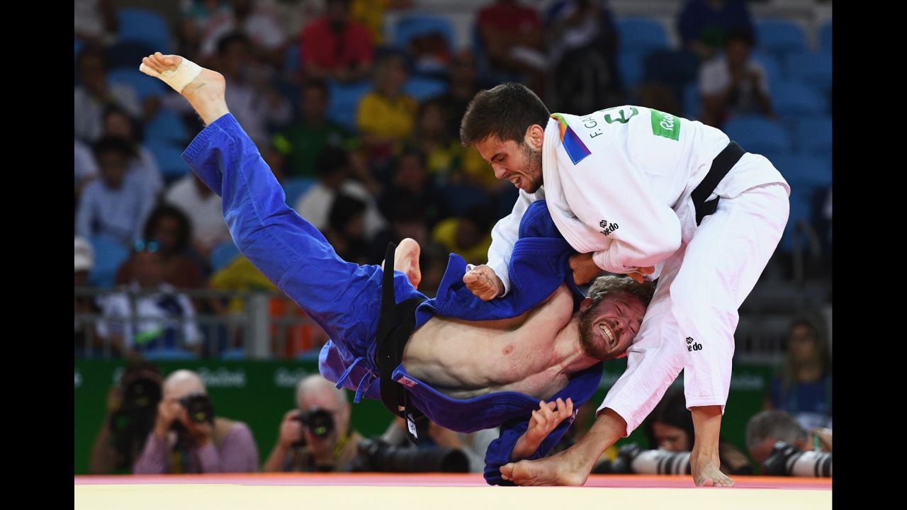 Tobias Englmaier of Germany, left, competes against Francisco Garrigos of Spain in the men's 60kg judo.