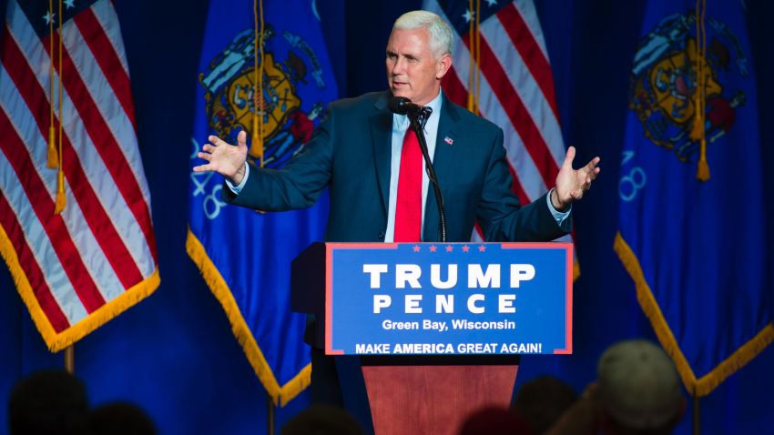 Republican vice presidential candidate, Indiana Gov. Mike Pence greets the crowd before introducing Republican presidential candidate Donald Trump at a rally on August 5, 2016 in Green Bay, Wisconsin.