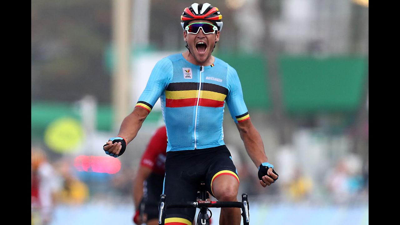 Greg Van Avermaet of Belgium celebrates winning the gold medal after crossing the finishing line the men's road race.
