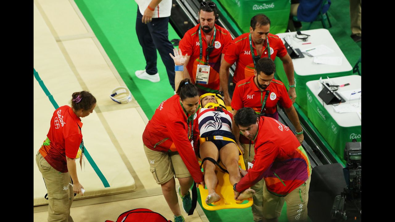 French gymnast Samir Ait Said receives medical attention after breaking his leg while competing on the vault during the artistic gymnastics men's team qualification round.