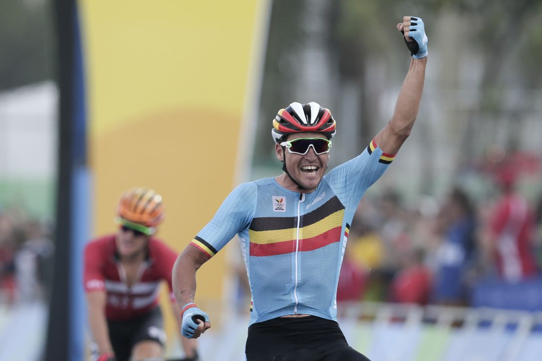 Greg van Avermaet celebrates after crossing the finish line to win the men's cycling road race. 