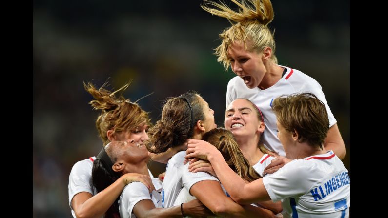 Carli Lloyd of United States celebrates with her team after scoring during the women's Group G first round match between United States and France. The United States won the match 1-0.