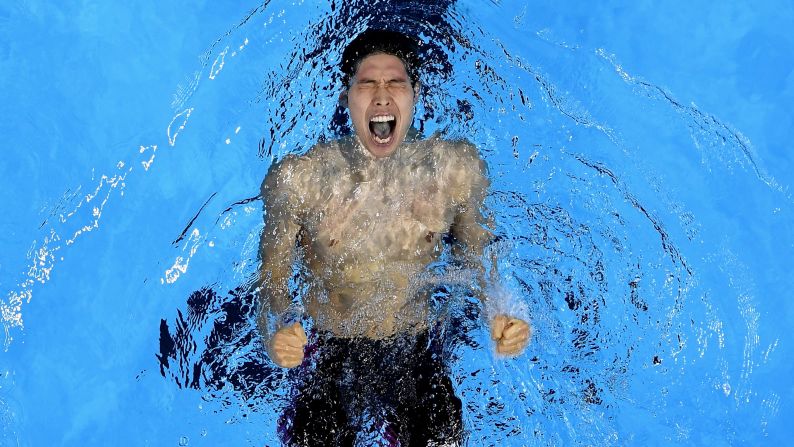 Kosuke Hagino of Japan celebrates winning gold in the final of the men's 400-meter individual medley on the first day of competition at the 2016 Olympic Games on Saturday, August 6.