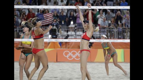 Kerri Walsh Jennings celebrates with her teammate April Ross after winning a beach volleyball match against Australia, 21-14, 21-13, at the 2016 Summer Olympics in Rio de Janeiro, Brazil, early in the morning on Sunday August 7.