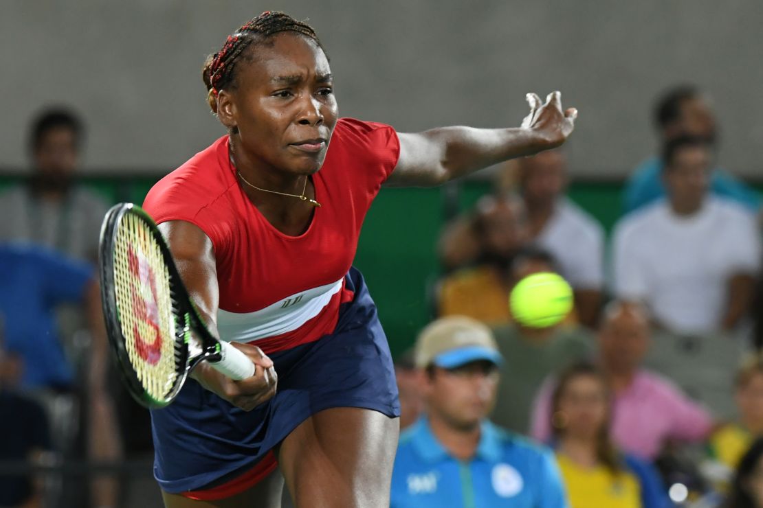 Venus Williams returns the ball to Kirsten Flipkens.