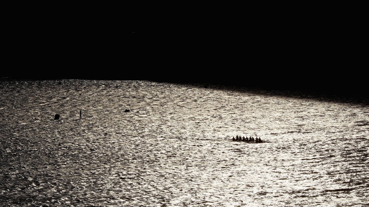 Competitors warm up prior to a rowing event at the Lagoa Stadium.