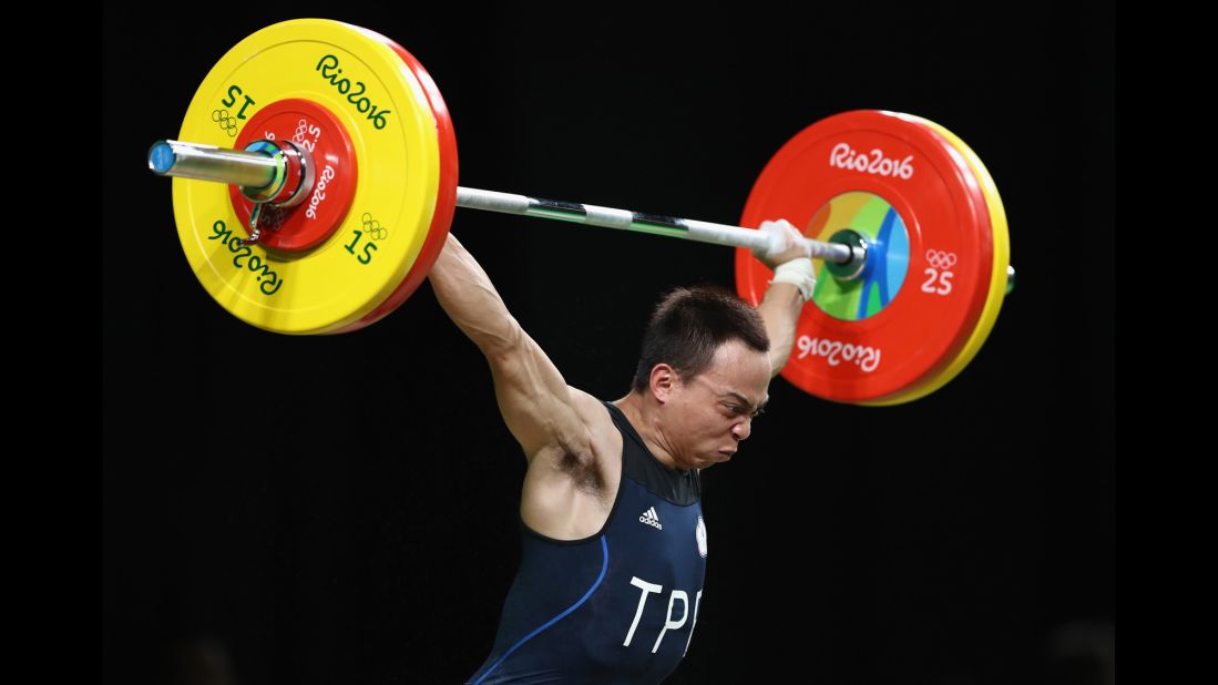Chi-Chung Tan of Chinese Taipei competes during the men's 53kg Group A weightlifting contest.