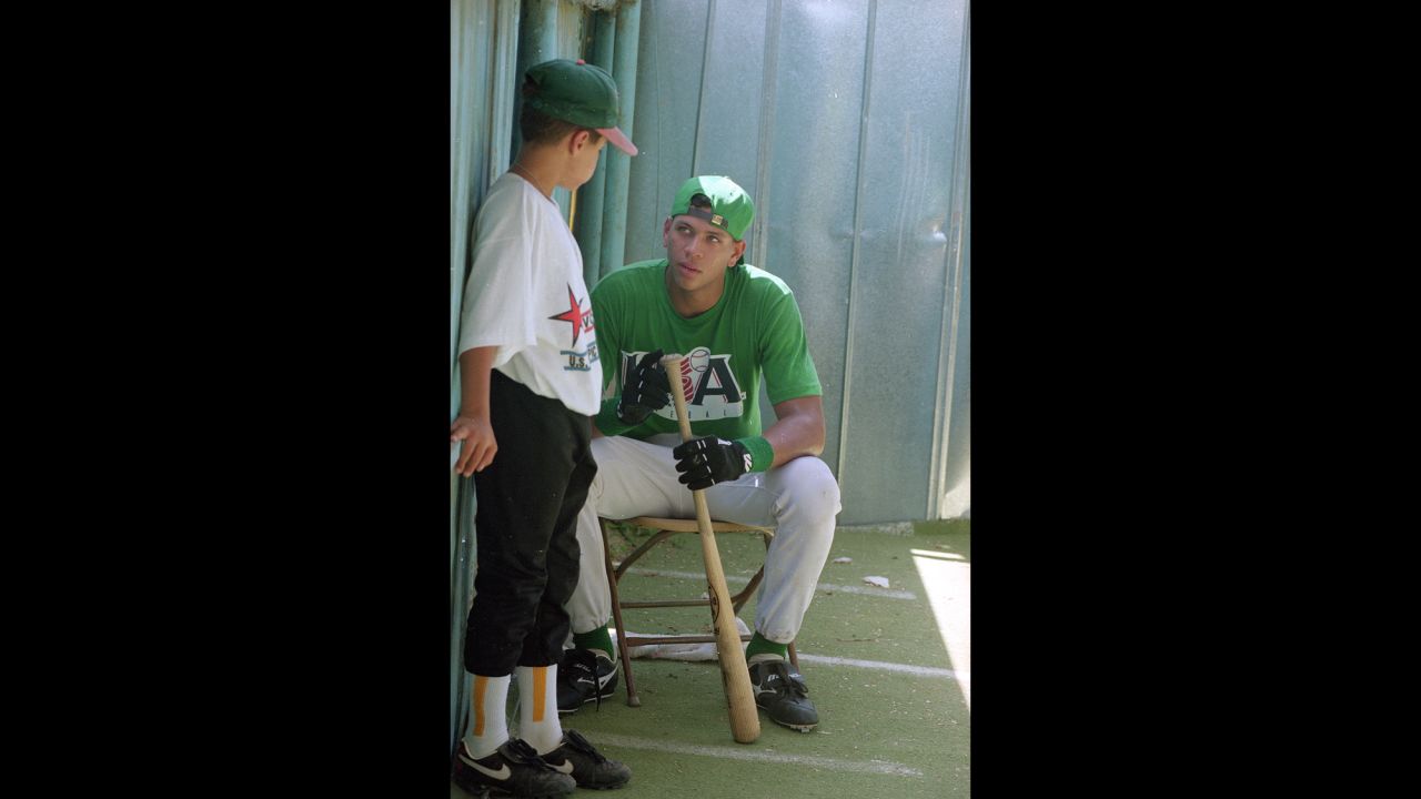 Rodriguez, shown here as a teenager in 1993, talks with 11-year-old John Santos Griffith during practice for the U.S. Olympic Festival Competition in San Antonio, Texas.