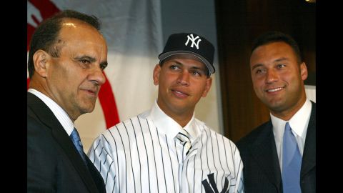 Rodriguez, center stands with Yankees Manager Joe Torre, left, and Derek Jeter at a press conference at Yankee Stadium on February 17, 2004 to formally welcome him to the team. Rodriguez was traded to the Yankees from the Texas Rangers in exchange for Alfonso Soriano and Joaquin Arias.