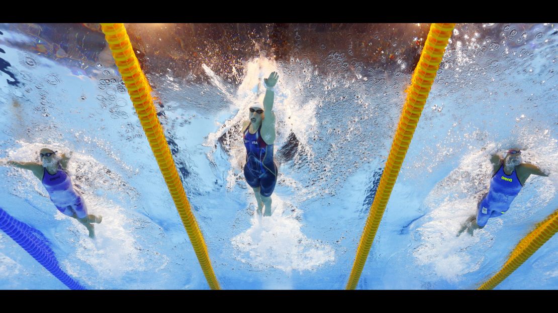 Katie Ledecky, center, competes in a heat of the women's 400-meter freestyle during the swimming competitions. 