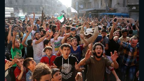 Syrians in Aleppo celebrate in the streets