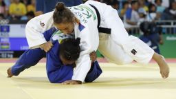 Kosovo's Majlinda Kelmendi (white) competes with Mauritius' Christianne Legentil during their women's -52kg judo contest quarterfinal match of the Rio 2016 Olympic Games in Rio de Janeiro on August 7, 2016. / AFP / Jack GUEZ        (Photo credit should read JACK GUEZ/AFP/Getty Images)