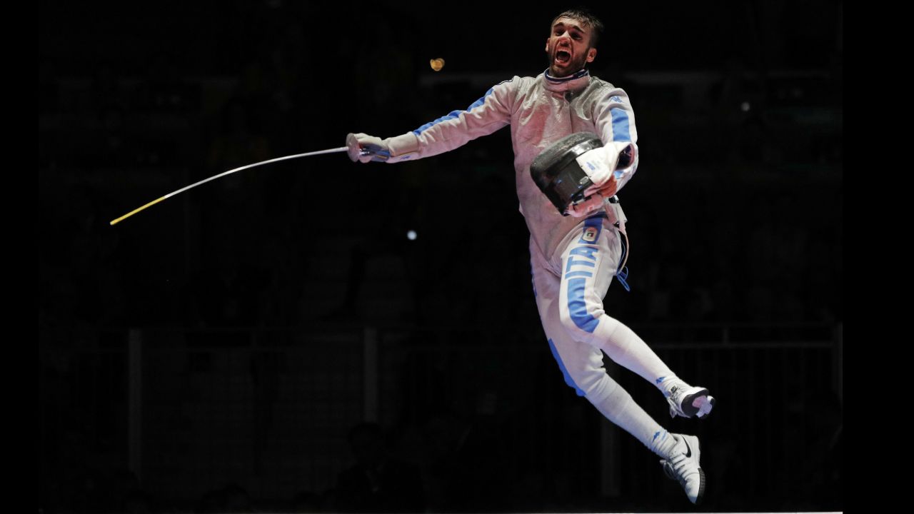 Daniele Garozzo of Italy celebrates after defeating Alexander Massialas of the United States, winning the gold medal at the men's individual foil fencing event.