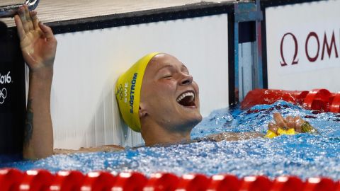 Sarah Sjostrom of Sweden celebrates winning gold and setting a new world record in the women's 100m butterfly.