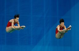 Tingmao Shi and Minxia Wu of China compete in the Women's Diving Synchronised 3m Springboard Final