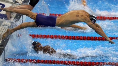 Michael Phelps back has cupping marks, as he competes in the Final of the Men's 4 x 100m Freestyle Relay.