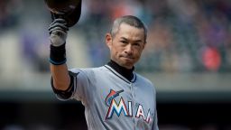 Ichiro Suzuki of the Miami Marlins tips his hat to the crowd after hitting a seventh inning triple against the Colorado Rockies for the 3,000th hit of his MLB career during a game at Coors Field on August 7, 2016 in Denver.