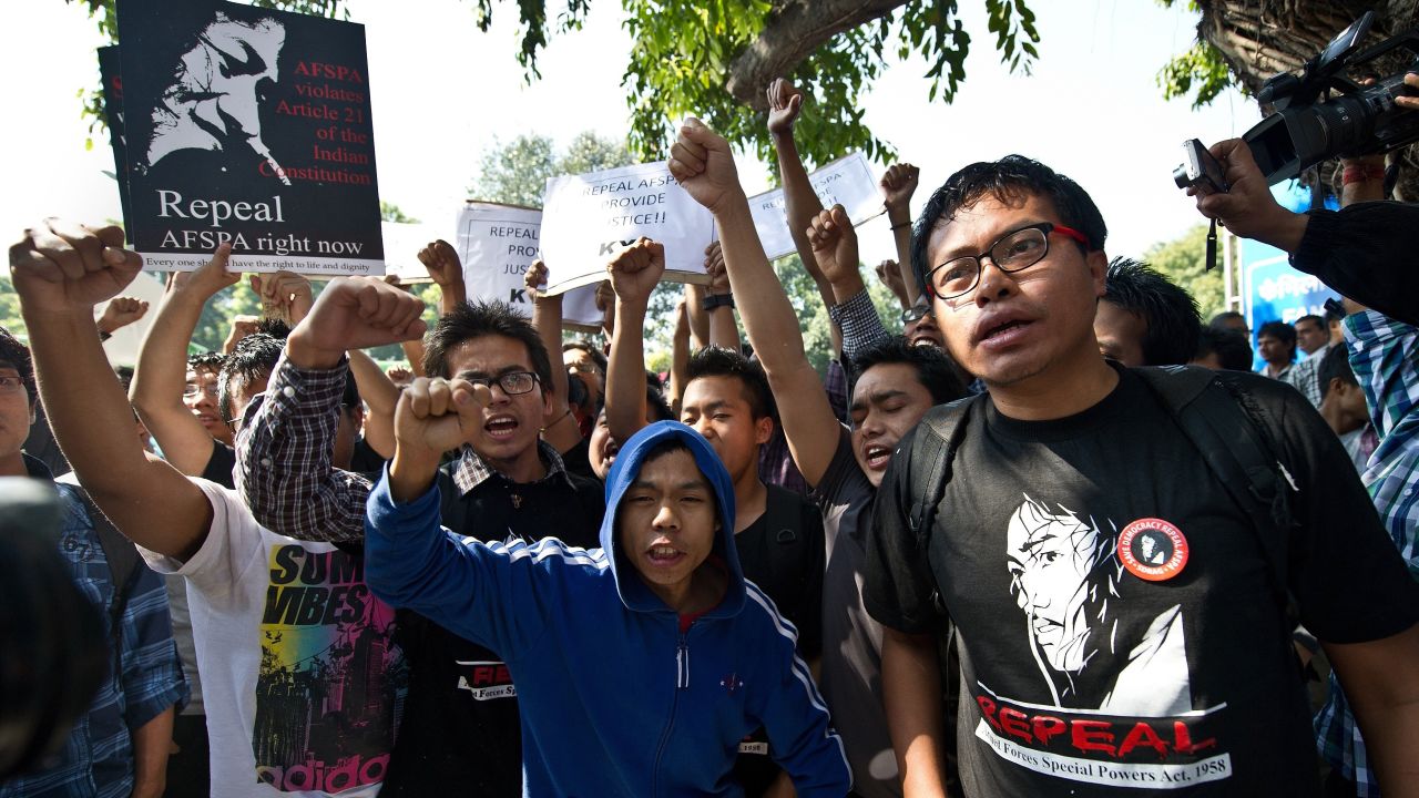 Supporters of Sharmila shout slogans outside the New Delhi court where she made an appearance in March 2013. The activist rejected suicide charges put against her by the Delhi government.