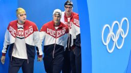 Russia's Andrey Grechin, Danila Izotov, Vladimir Morozov and Alexander Sukhorukov arrive for the men's 4x100-meter freestyle final during the swimming competitions at the 2016 Summer Olympics, Sunday, Aug. 7, 2016, in Rio de Janeiro, Brazil. (AP Photo/Martin Meissner)