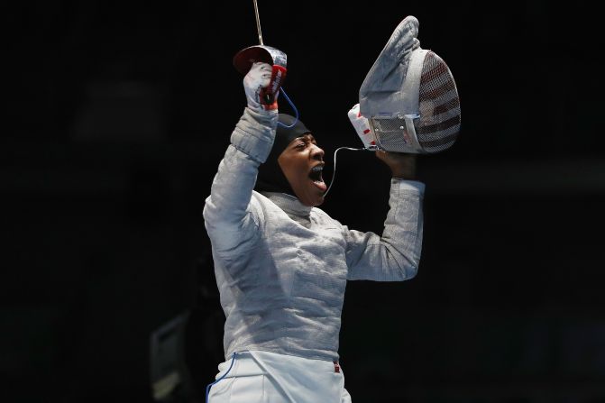 U.S. fencer Ibtihaj Muhammad celebrates after defeating Ukraine's Olena Kravatska in the individual sabre competition on Monday, August 8. Muhammad is the <a href="index.php?page=&url=http%3A%2F%2Fwww.cnn.com%2F2016%2F08%2F08%2Fsport%2Fibtihaj-muhammad-individual-sabre-fencing-2016-rio-olympics%2Findex.html" target="_blank">first U.S. Olympian to compete in hijab</a>.