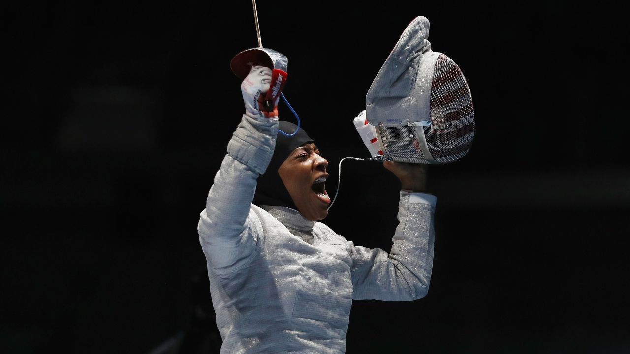 Ibtihaj Muhammad of the United States celebrates victory over Olena Kravatska of Ukraine during the Women's Individual Sabre on Day 3 of the Rio 2016 Olympic Games at Carioca Arena 3 in Rio de Janeiro.