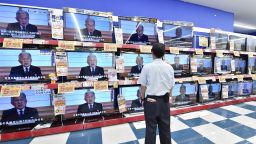 A man watches television screens in an electronics shots broadcasting a pre-recorded speech by Japanese Emperor Akihito in Tokyo on Monday, August 8. In a rare public address, Emperor Akihito said his advancing age and weakening health mean he may no longer be able to carry out his duties, setting the stage for Japan to prepare for an historic abdication.