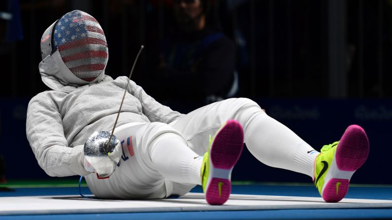 Ibtihaj Muhammad, <a href="index.php?page=&url=http%3A%2F%2Fwww.cnn.com%2F2016%2F08%2F08%2Fsport%2Fibtihaj-muhammad-individual-sabre-fencing-2016-rio-olympics%2Findex.html" target="_blank">the first American to wear a hijab in the Olympics,</a> reacts on the piste as she competes against France's Cecilia Berder in a fencing bout. Berder won 15-12 to advance to the quarterfinals of the sabre competition.