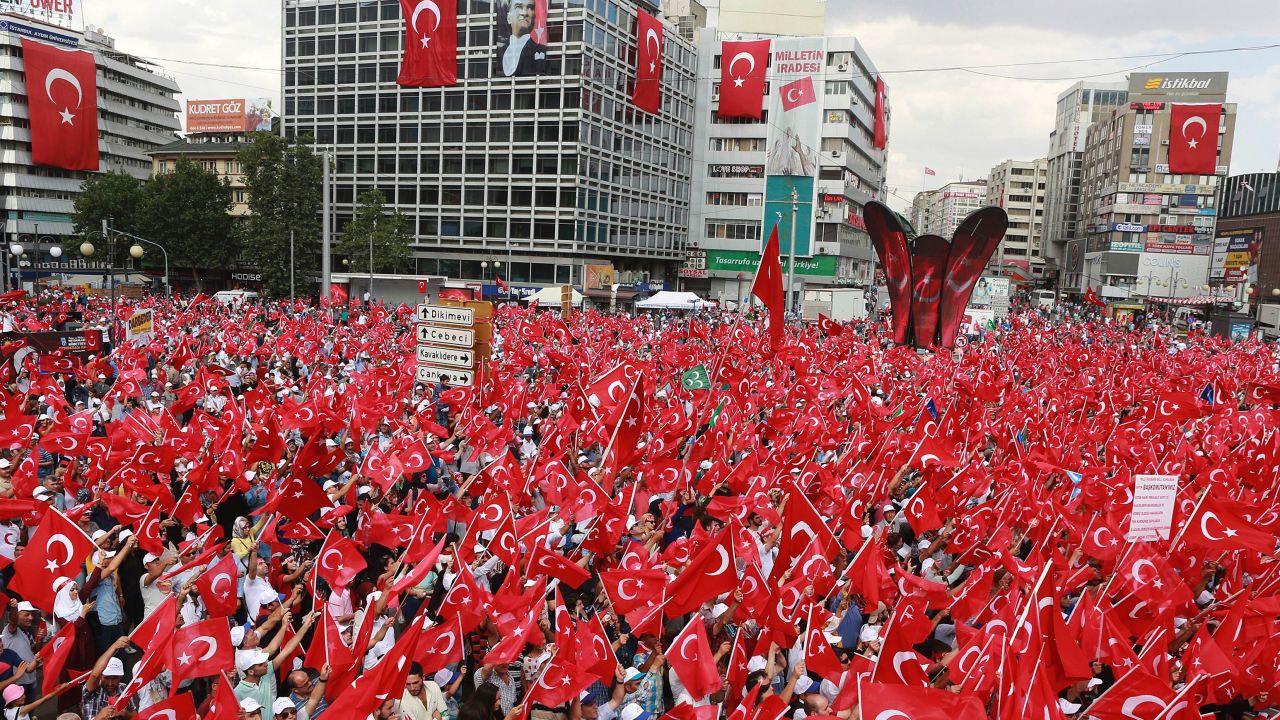People wave Turkish national flags as they gather on August 7, 2016 at Kizilay Democracy Square in Ankara during a rally against failed military coup on July 15. 
Hundreds of thousands of people gathered in Istanbul today for a pro-democracy rally organised by the ruling party, bringing to an end three weeks of demonstrations in support of President Recep Tayyip Erdogan after last month's failed coup. / AFP / ADEM ALTAN        (Photo credit should read ADEM ALTAN/AFP/Getty Images)