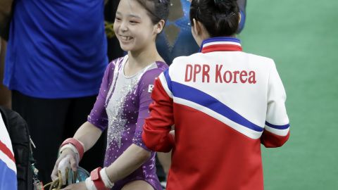 South Korea's Lee Eun-ju, left, smiles as she talks with North Korea's Hong Un Jong during the artistic gymnastics women's qualification at the 2016 Summer Olympics in Rio de Janeiro, Brazil.