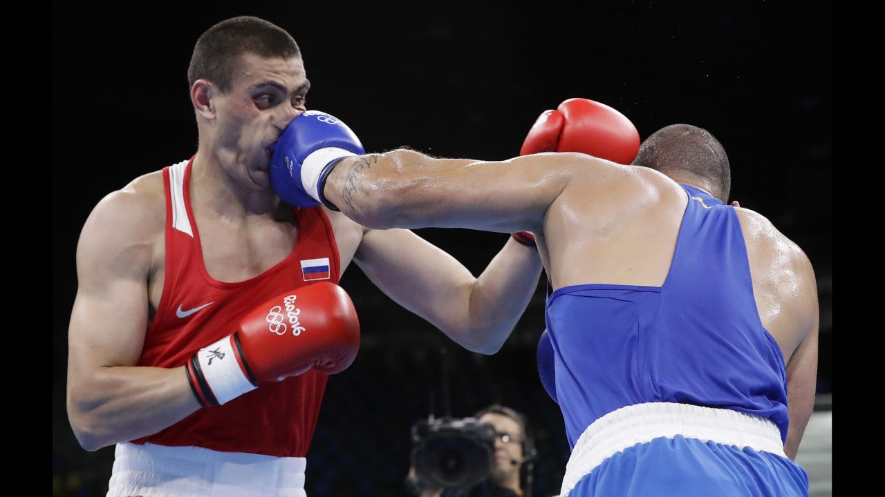 Brazil's Juan Nogueira, right, lost to Russia's Evgeniy Tishchenko in their heavyweight boxing match.