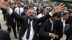 A Pakistan lawyer shouts slogans during a demonstration to condemn a suiciding bombing in Quetta that killed dozens of people and wounded many more, in Lahore, Pakistan, Monday, Aug. 8, 2016. Senior police official Zahoor Ahmed Afridi says the blast took place shortly after the body of a prominent lawyer, killed in a shooting attack earlier in the day, was brought to the hospital. It's unclear if the two events are in any way connected. (AP Photo/K.Chaudary)