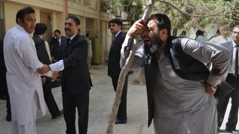 Pakistani lawyers mourn the deaths of their colleagues following a bomb blast in QuettA. 