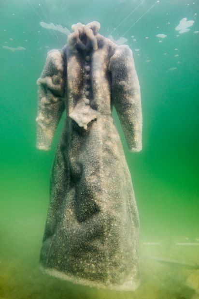 In her "Salt Bride" photography series, Israeli artist Sigalit Landau documents how a dress transformed over three months being submerged in the Dead Sea. 
