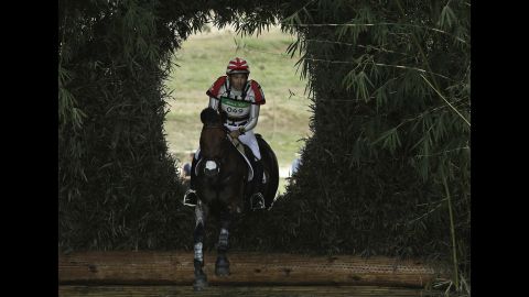 Japanese rider Yoshiaki Oiwa, on The Duke of Cavan, competes in the cross-country phase of the eventing competition.