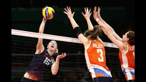 U.S. volleyball player Kimberly Hill spikes the ball during a preliminary match against the Netherlands. The United States won 3-2.
