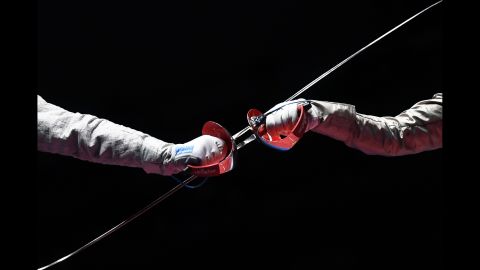 Russian fencer Sofya Velikaya, left, competes against France's Manon Brunet during a sabre semifinal bout. Velikaya defeated Brunet but lost in the final to her Russian compatriot Yana Egorian.