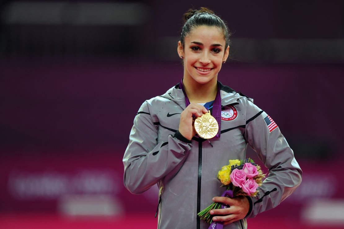 Aly Raisman displays her gold medal for the women's floor exercise during the London 2012 Olympics. 