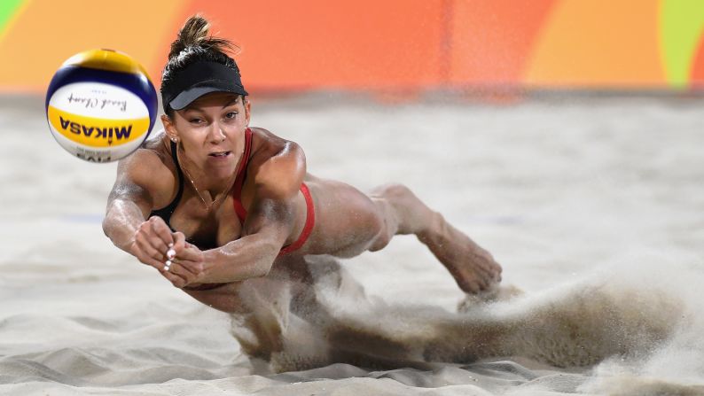 Canada's Jamie Lynn Broder dives for the ball during a beach volleyball match on Sunday, August 7.