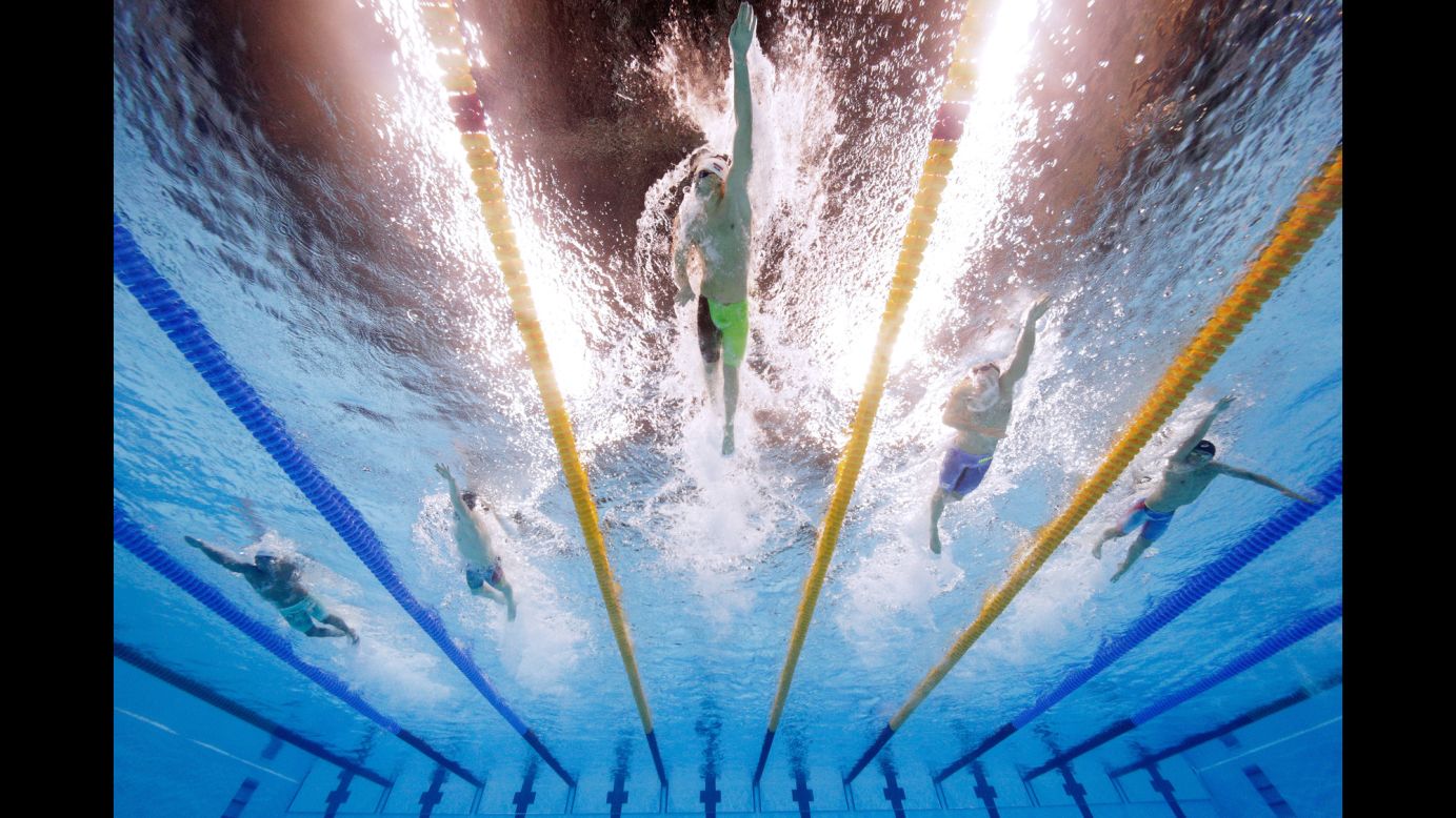 Russia's Aleksandr Krasnykh leads a group of swimmers during a 400-meter freestyle race on Saturday, August 6.