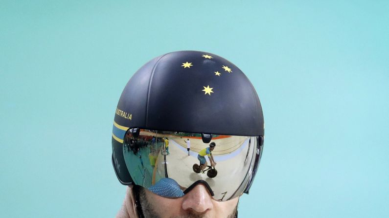 An Australian cyclist is reflected on a teammate's visor during a training session on Thursday, August 4.
