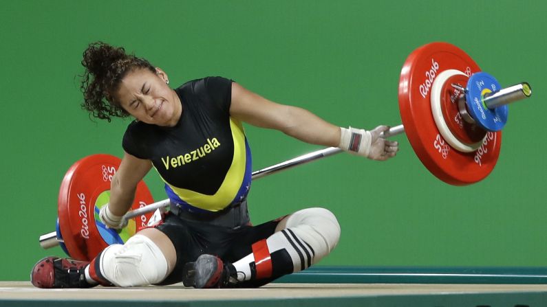 Venezuelan weightlifter Yusleidy Figueroa falls as she competes in the 58-kilogram weight class.