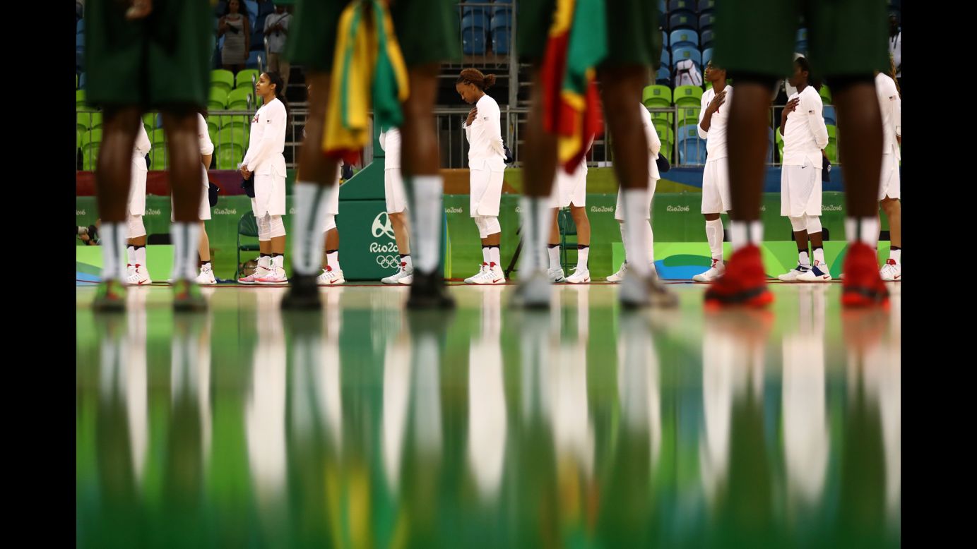 The women's basketball teams from Senegal and the United States line up before their preliminary round game on Sunday, August 7. The United States won 121-56, breaking their record for most points scored in the Olympics.