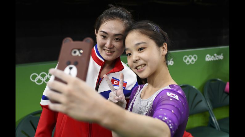 South Korean gymnast Lee Eun-ju <a href="index.php?page=&url=http%3A%2F%2Fwww.cnn.com%2F2016%2F08%2F08%2Fsport%2Fkorea-gymnast-selfie%2Findex.html" target="_blank">takes a selfie</a> with North Korean gymnast Hong Un-jong during training. Relations have been frosty between the North and South since its division following the end of World War II, but geopolitics were put to the side as the two Olympians came together.