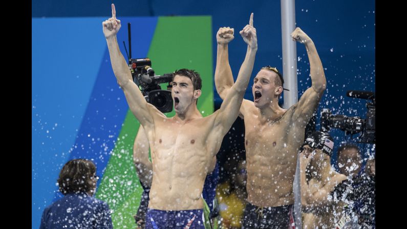 U.S. swimmers Michael Phelps, left, and Caeleb Dressel celebrate after their relay team won gold in the 4x100 freestyle on Sunday, August 7. It was the 19th gold medal for Phelps, the most decorated Olympian of all time.