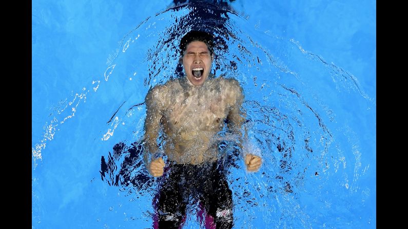 Japanese swimmer Kosuke Hagino celebrates in the pool after winning the 400-meter individual medley on Saturday, August 6.