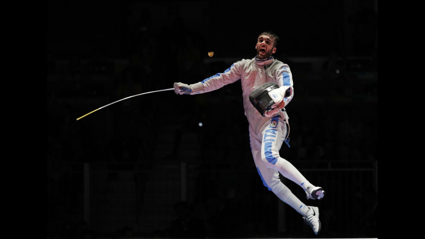 Italian fencer Daniele Garozzo leaps into the air after winning gold in the individual foil event on Sunday, August 7. 
